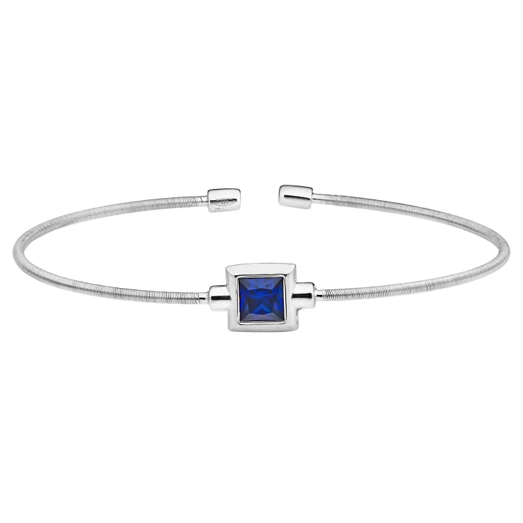 women’s multicolored bracelets-Rhodium Finish Sterling Silver Cable Cuff Bracelet with Princess Cut Simulated Sapphire Birth Gem