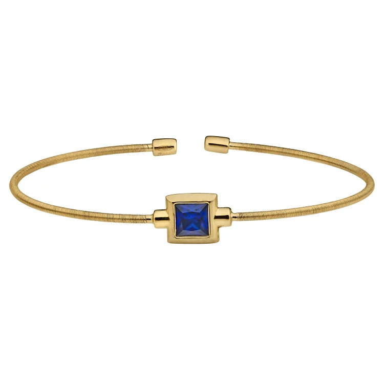 women’s leather bracelets-Gold Finish Sterling Silver Cable Cuff Bracelet with Princess Cut Simulated Sapphire Birth Gem